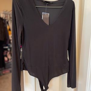 Black V neck body suit never worn size small